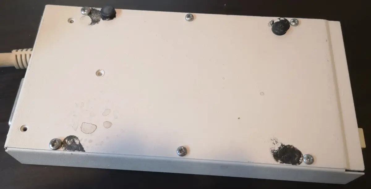 Grubby underside of external 3.5" floppy drive for Commodore Amiga - 2 rubber feet missing